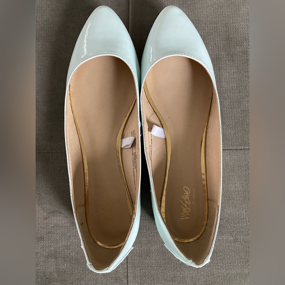 Mint green flats with gold embellishments, some wear